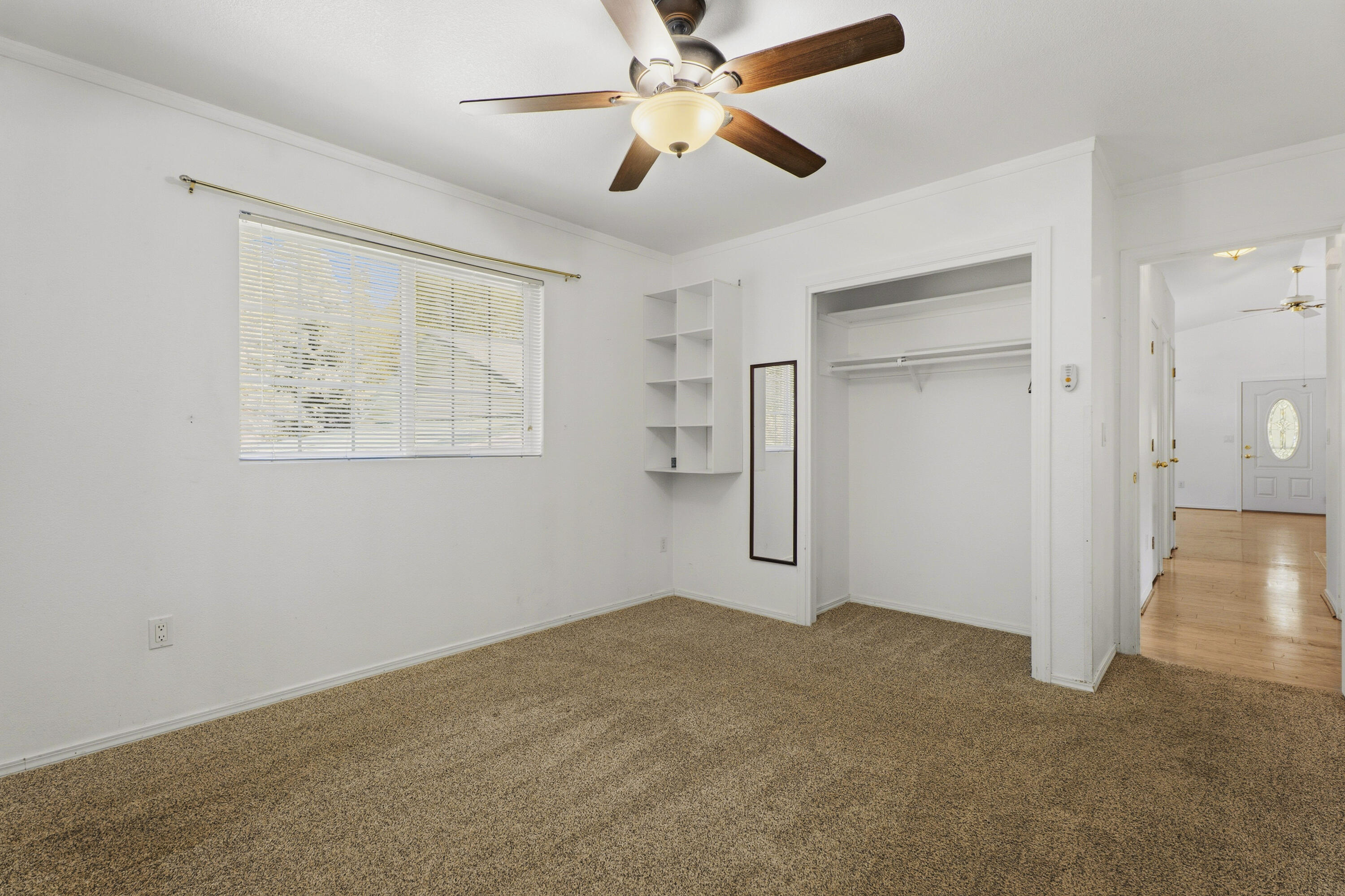 55885 Osprey Road Bend, OR 97707 - Photo 22 of 58 secondary bedroom with wide window, ceiling fan, and closet.