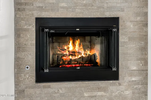 a view of a room with wooden floor and a window