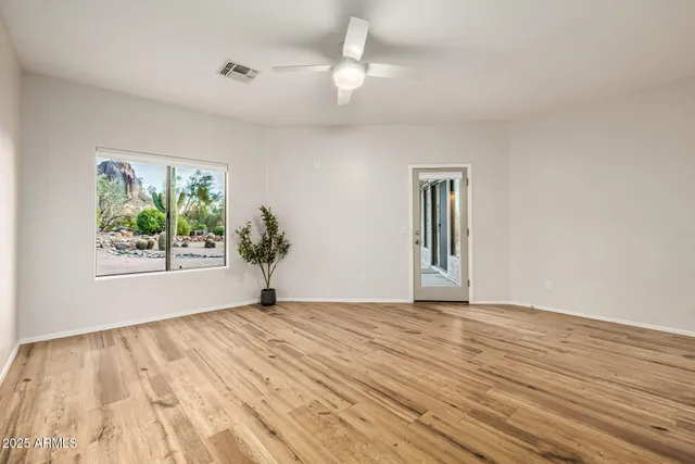 an aerial view of a house with a yard covered with snow