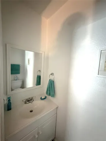 a bathroom with a sink and mirror