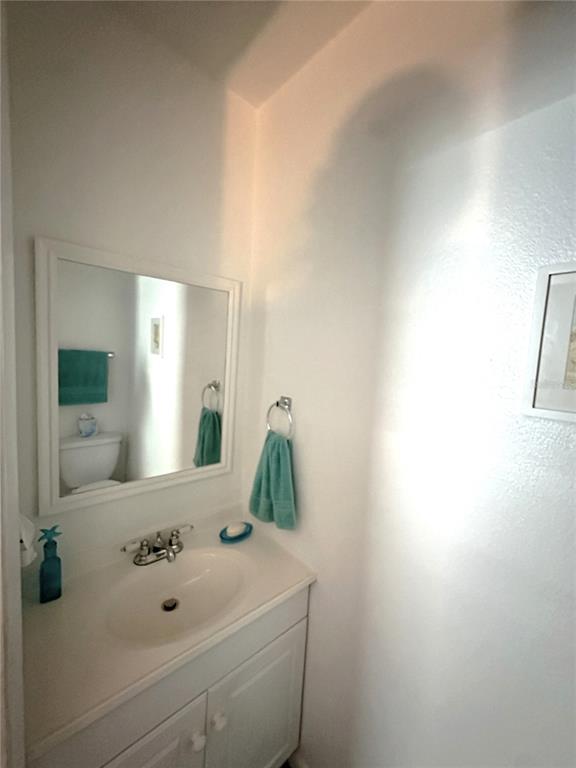 220 South 26th Street, Unit 3 Flagler Beach, FL 32136 - Photo 12 of 20 a bathroom with a sink and mirror