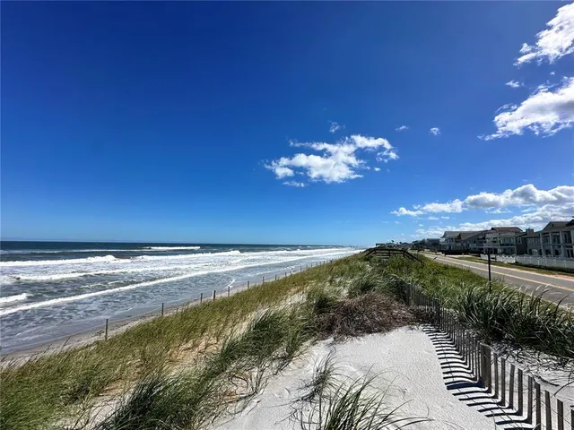 a view of a lake with a yard