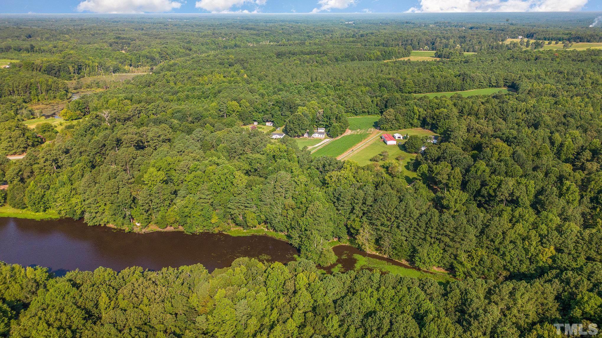 Lot 2 Wiley Road Spring Hope, NC 27882 - Photo 7 of 12 a view of a lake with a yard
