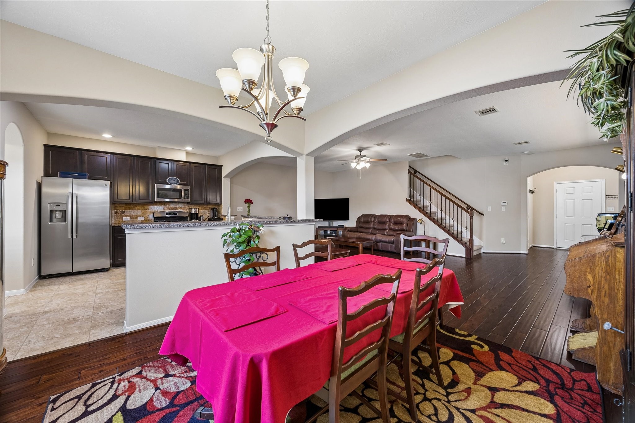 8433 Sunset Loch Drive Spring, TX 77379 - Photo 10 of 25 a view of a dining room with furniture and chandelier