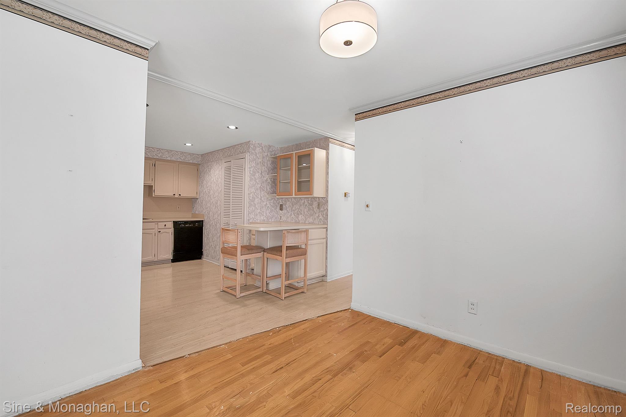 880 North Adams Road, Unit 2 Birmingham, MI 48009 - Photo 9 of 28 Dining room with updated light fixture