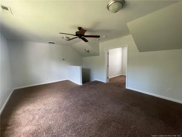 a view of empty room with windows