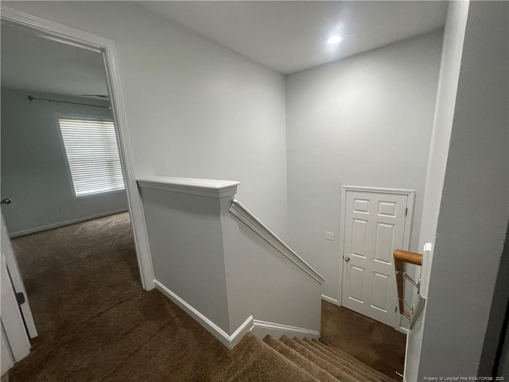 2239 Gray Goose Loop Fayetteville, NC 28306 - Photo 13 of 26 a view of hallway with window and wooden floor