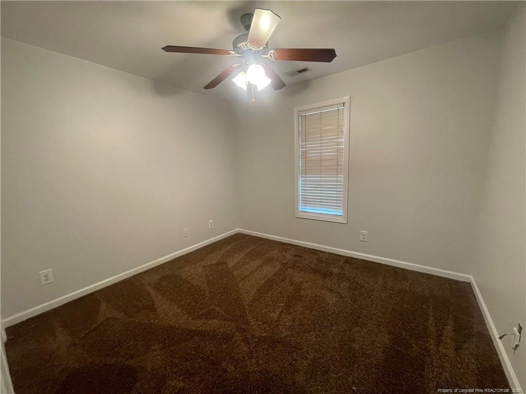 2239 Gray Goose Loop Fayetteville, NC 28306 - Photo 16 of 26 a view of an empty room with a chandelier fan