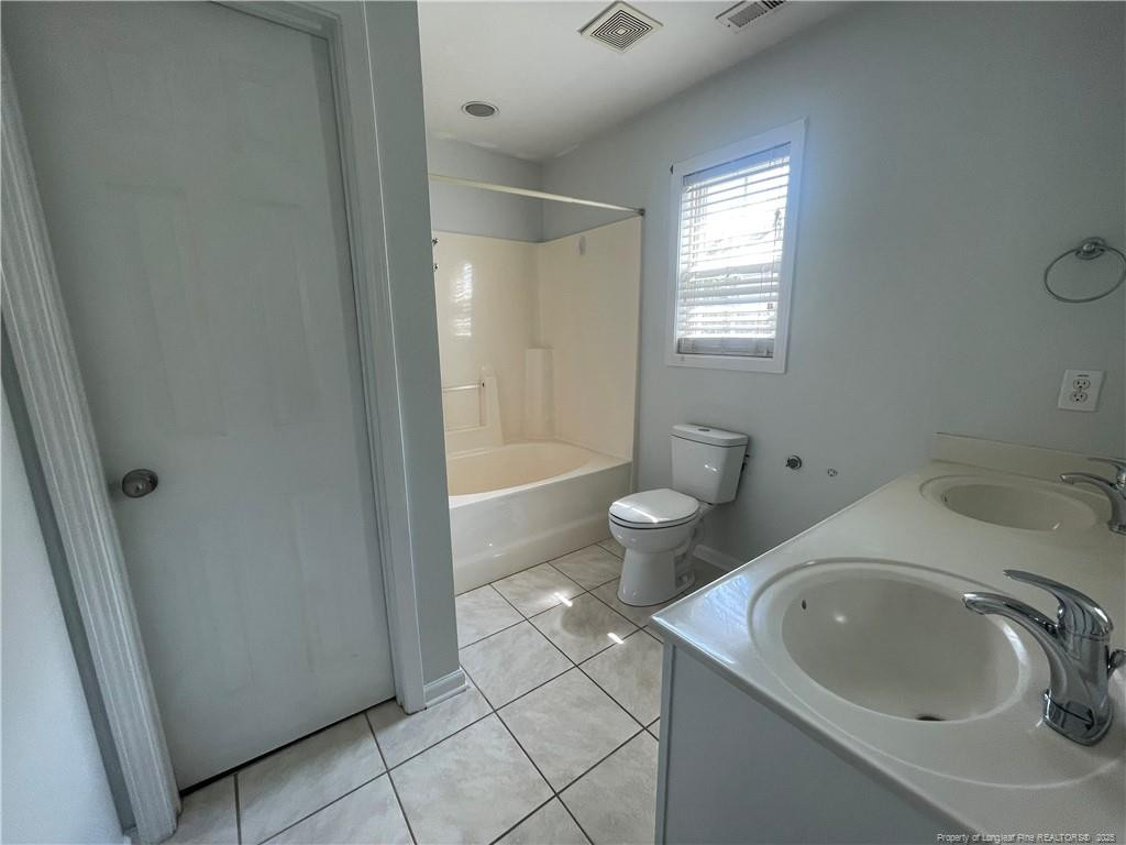 2239 Gray Goose Loop Fayetteville, NC 28306 - Photo 20 of 26 a bathroom with a sink and a tub