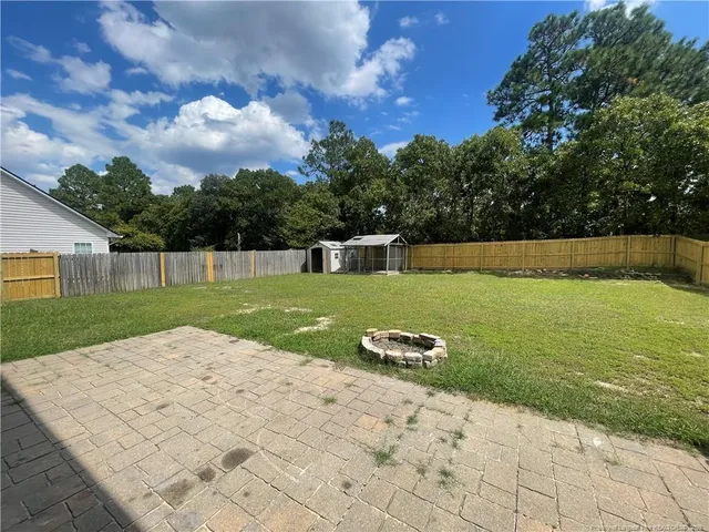 a view of swimming pool with a yard