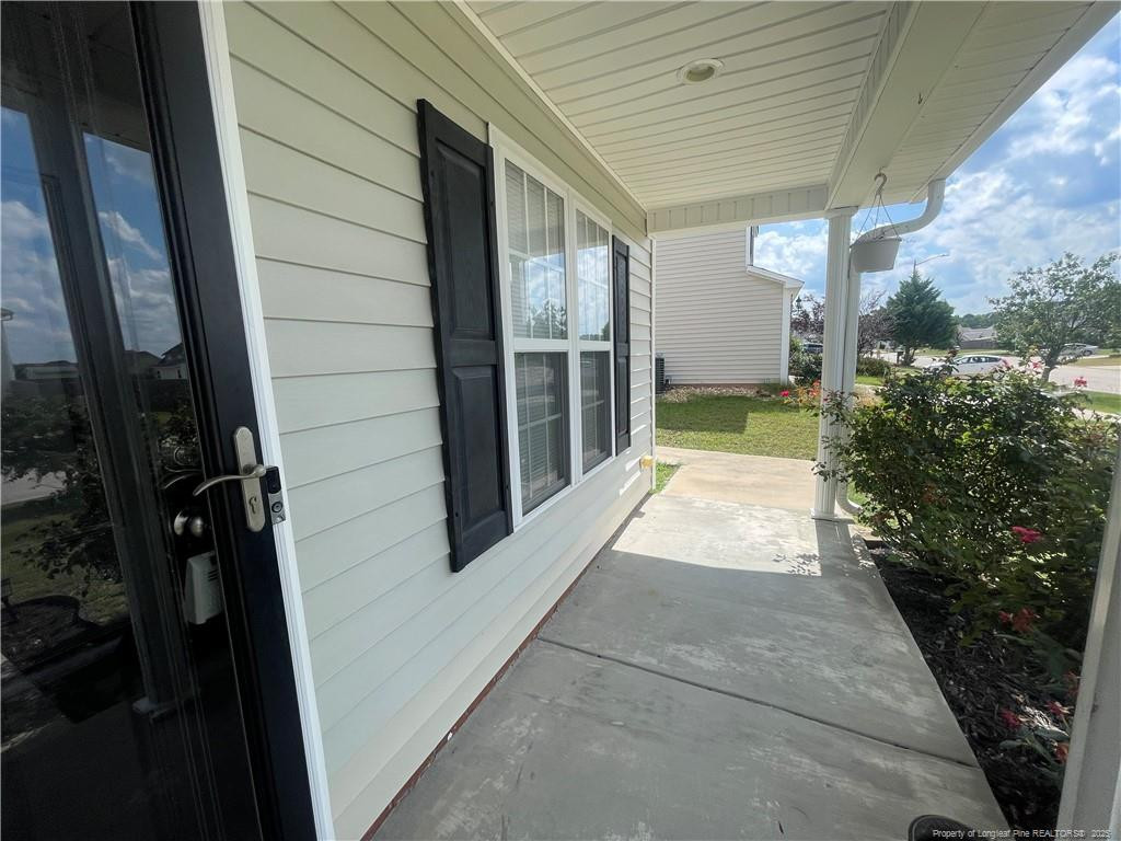 2239 Gray Goose Loop Fayetteville, NC 28306 - Photo 3 of 26 a view of a porch of the house