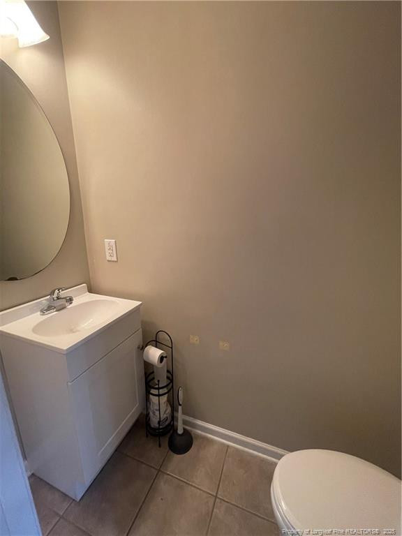 2239 Gray Goose Loop Fayetteville, NC 28306 - Photo 9 of 26 a bathroom with a sink a toilet and mirror