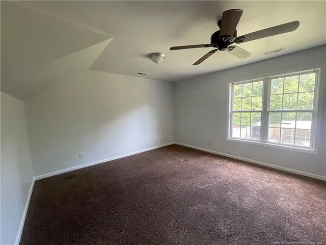 a view of empty room with windows