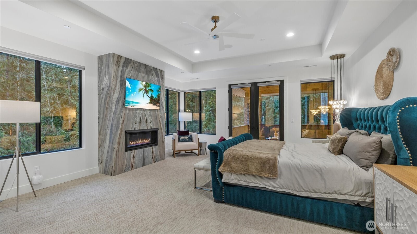 29657 Northeast 52nd Street Carnation, WA 98014 - Photo 29 of 40 a bedroom with bed and a fireplace