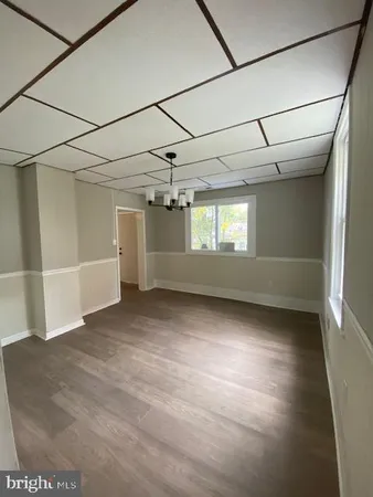 a view of empty room with windows