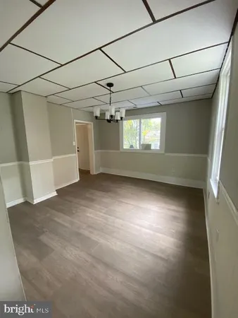 a view of a room with a dishwasher and a window