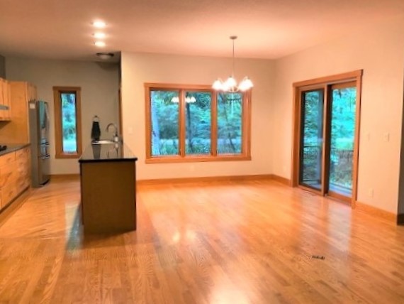 2110 Grand Detour Road Dixon, IL 61021 - Photo 11 of 21 a view of an empty room with a fireplace and a window