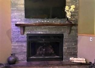 2110 Grand Detour Road Dixon, IL 61021 - Photo 14 of 21 a fireplace with a stove and a wooden floor