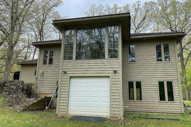 2110 Grand Detour Road Dixon, IL 61021 - Photo 4 of 21 a view of a house with a window and brick wall