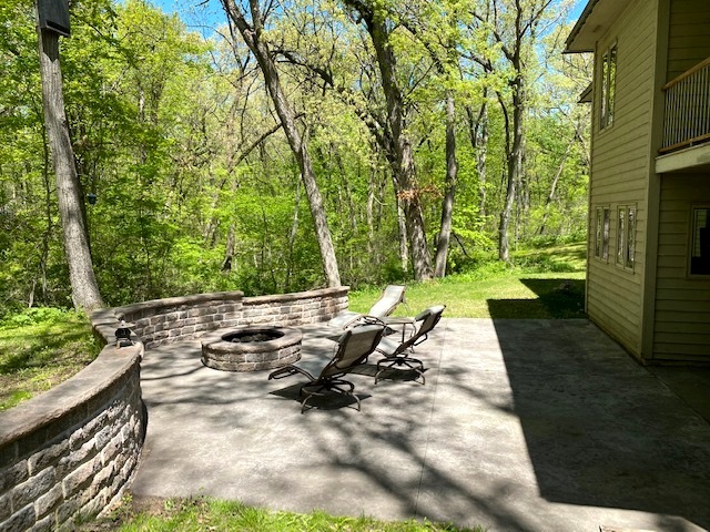 2110 Grand Detour Road Dixon, IL 61021 - Photo 5 of 21 a view of a patio with table and chairs with wooden floor and fence