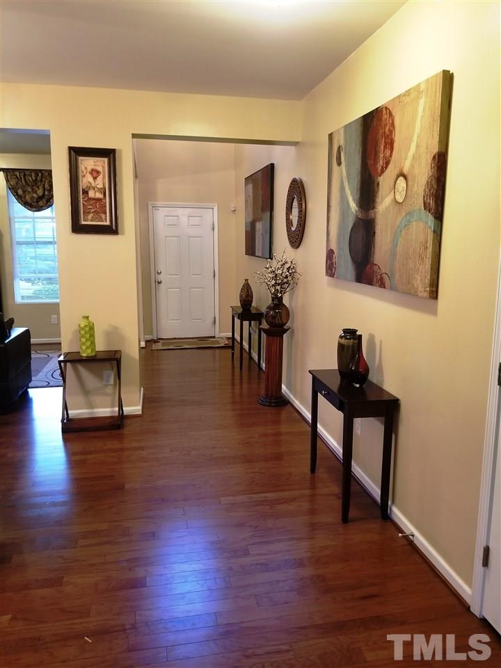 607 Hope Valley Road Knightdale, NC 27545 - Photo 3 of 23 a living room with couches and painting on the wall