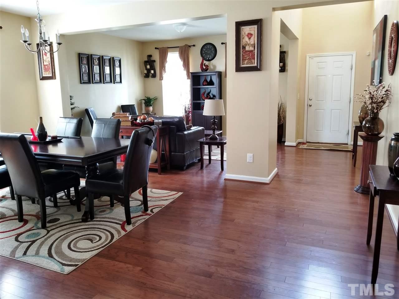 607 Hope Valley Road Knightdale, NC 27545 - Photo 5 of 23 a view of a dining room with furniture and wooden floor