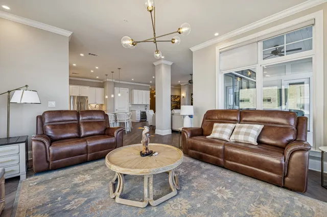 a view of cabinets a wooden floor and a window in the kitchen