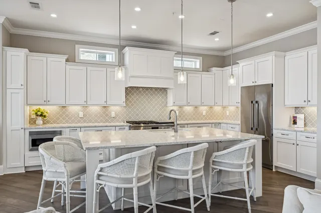 a spacious bedroom with a bed and a couch