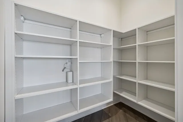 a bathroom with a granite countertop shower sink and mirror