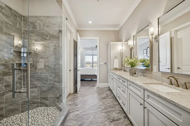 a bedroom with a bed and a ceiling fan