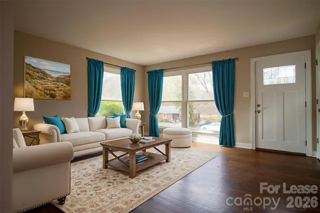 a living room with furniture and a large window