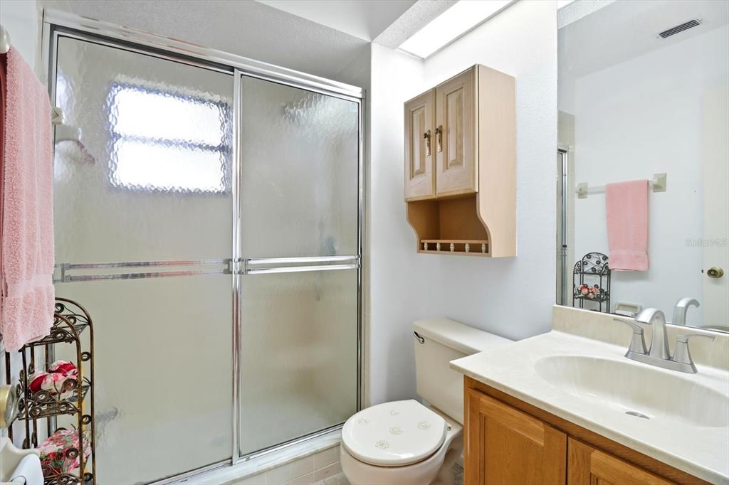 9470 Nakoma Way Weeki Wachee, FL 34613 - Photo 16 of 45 a bathroom with a sink toilet and shower