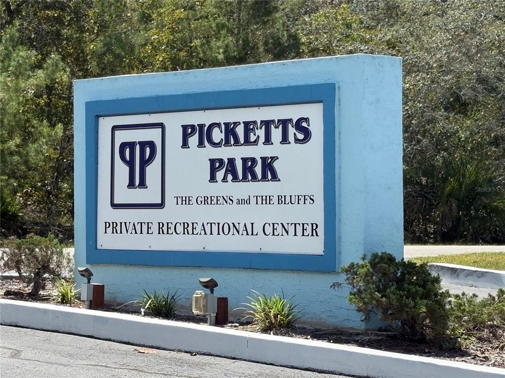 9470 Nakoma Way Weeki Wachee, FL 34613 - Photo 32 of 45 a sign on the side of a building