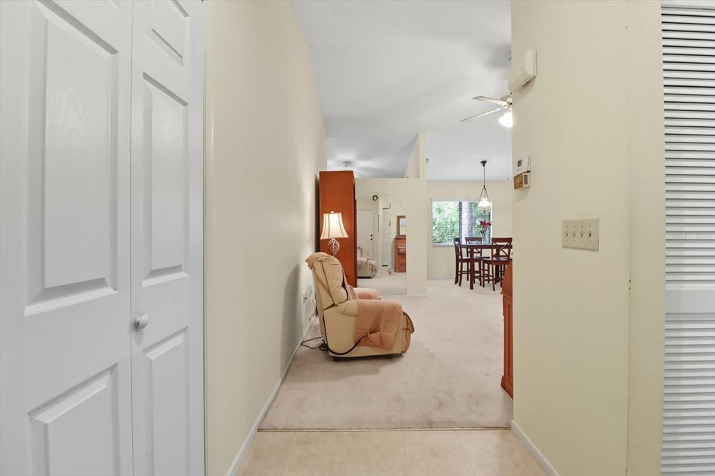 9470 Nakoma Way Weeki Wachee, FL 34613 - Photo 4 of 45 a bedroom with furniture and a lamp