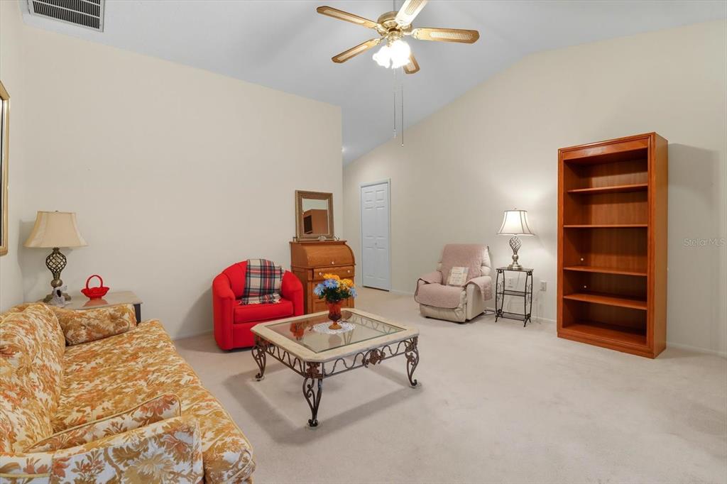 9470 Nakoma Way Weeki Wachee, FL 34613 - Photo 8 of 45 a bedroom with furniture and a bed