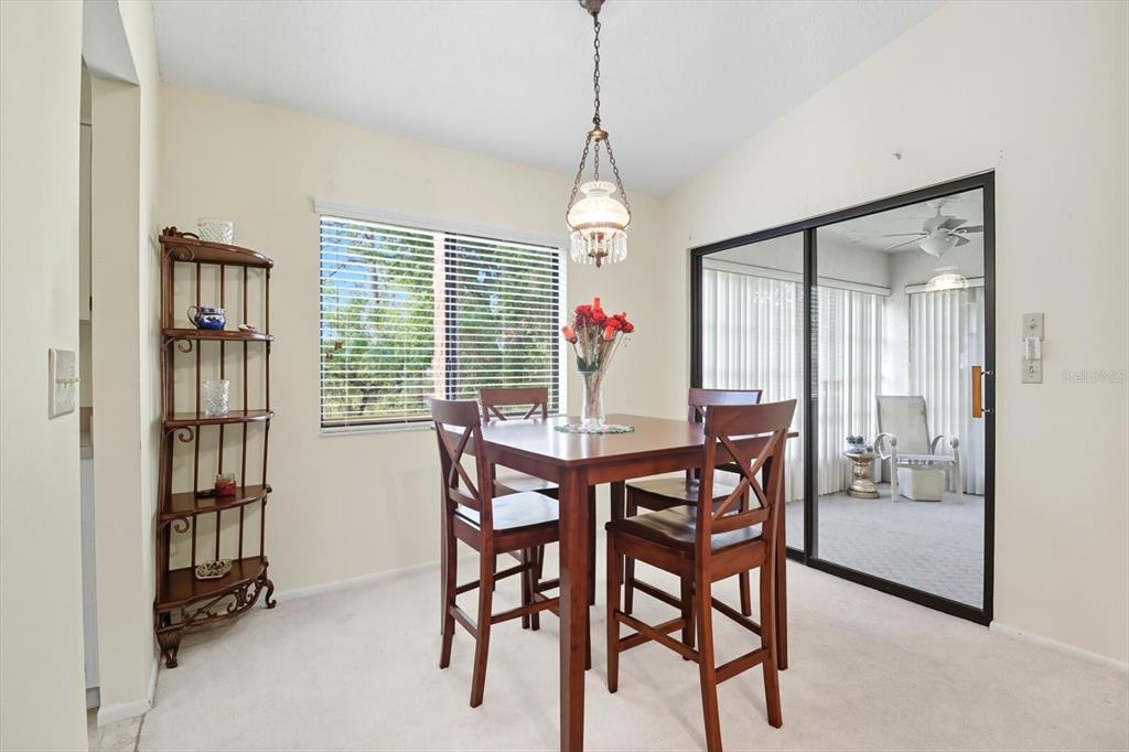 9470 Nakoma Way Weeki Wachee, FL 34613 - Photo 9 of 45 a dining room with furniture and window