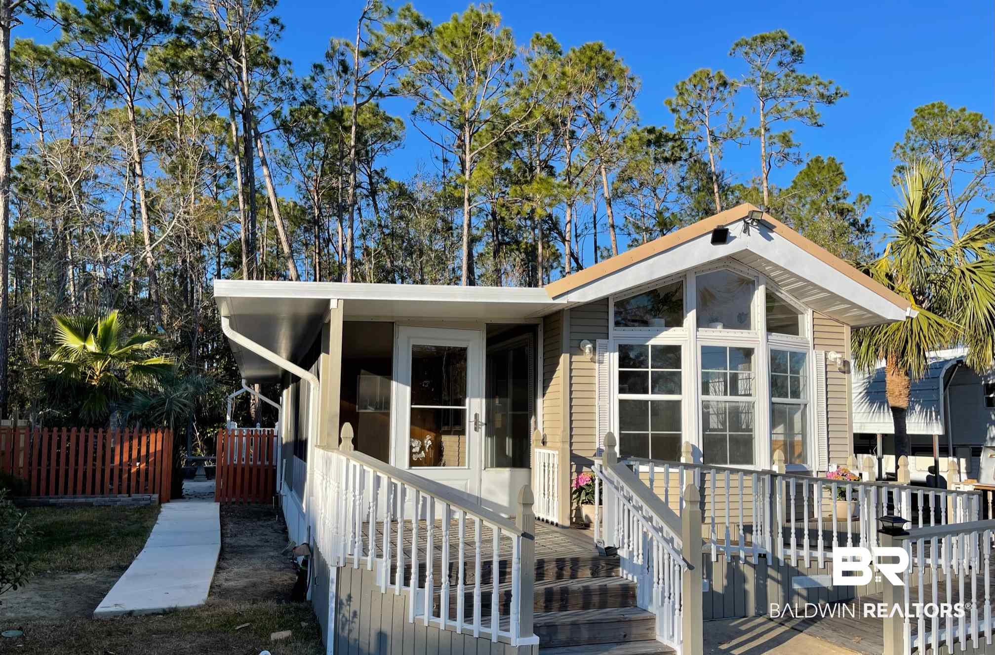 186 Defuniak Loop Lillian, AL 36549 - Photo 2 of 20 Paved walkway to back yard.