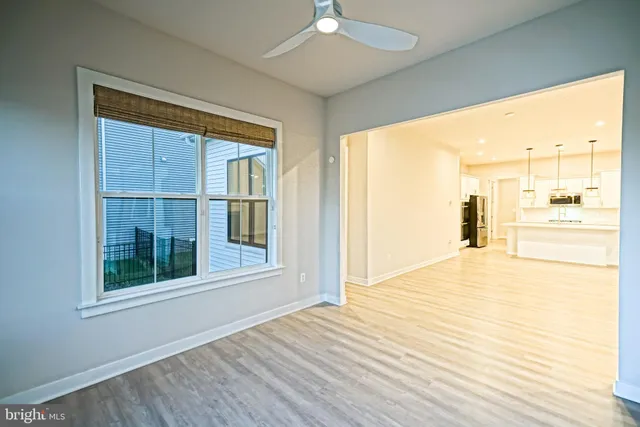 a living room with fireplace furniture and a wooden floor