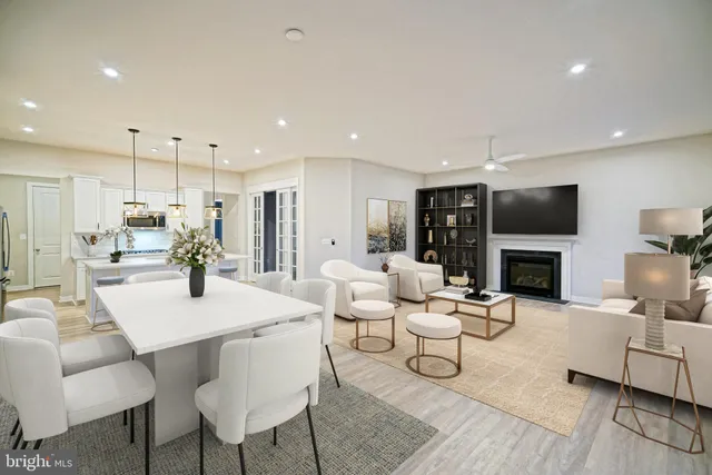 a large kitchen with kitchen island a sink stainless steel appliances and cabinets