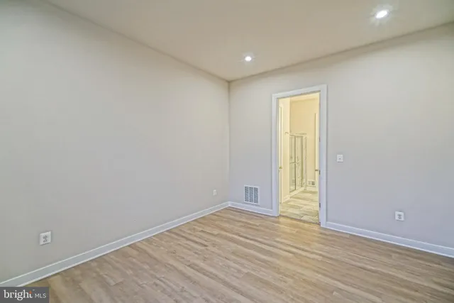 a bathroom with a double vanity sink and mirror with shower