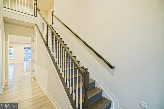 a view of an empty room with stairs