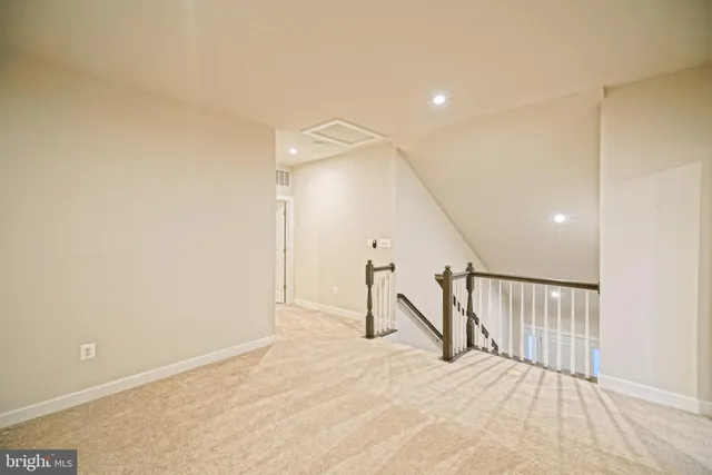 a living room with furniture and a lamp