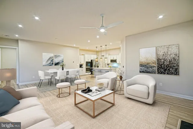 a view of a kitchen with a dishwasher kitchen stove cabinets and wooden floor