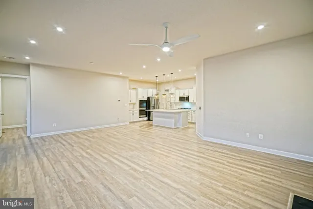 a living room with fireplace furniture and a flat screen tv