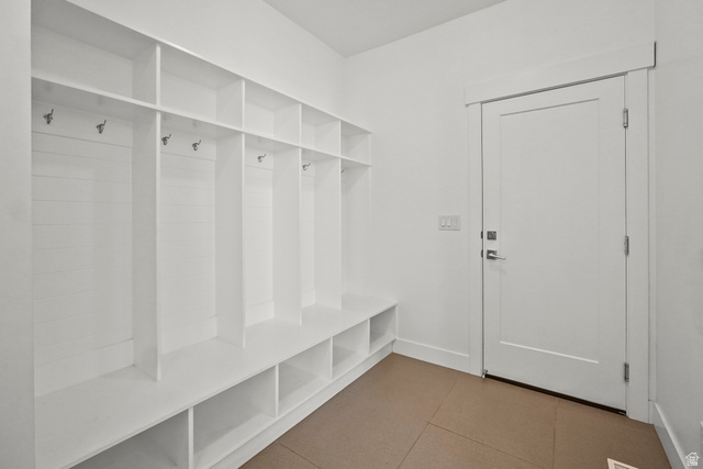 15008 South Springtime Road Draper, UT 84020 - Photo 18 of 37 Mudroom featuring light tile patterned flooring and baseboards