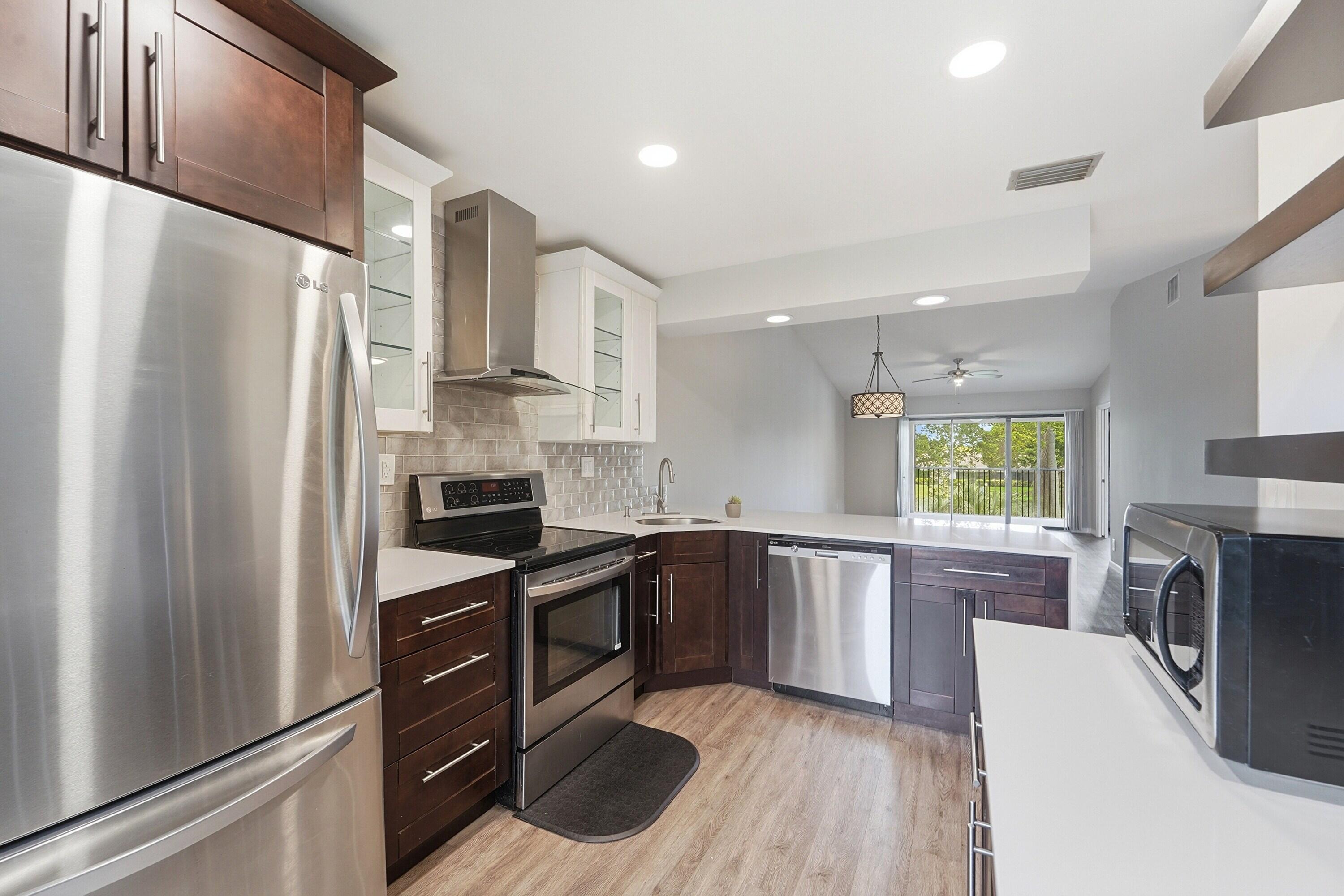 1033 Banks Road, Unit 203 Margate, FL 33063 - Photo 2 of 16 Kitchen to Dining and Livingroom