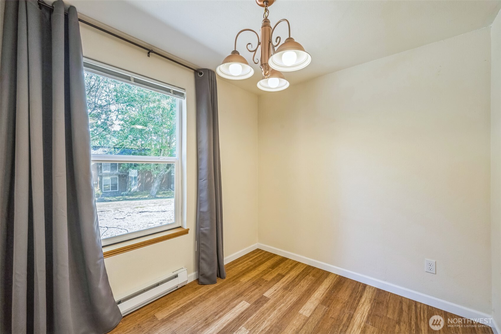 7311 224th Street Southwest, Unit C5 Edmonds, WA 98026 - Photo 13 of 28 a view of a room with wooden floor and windows