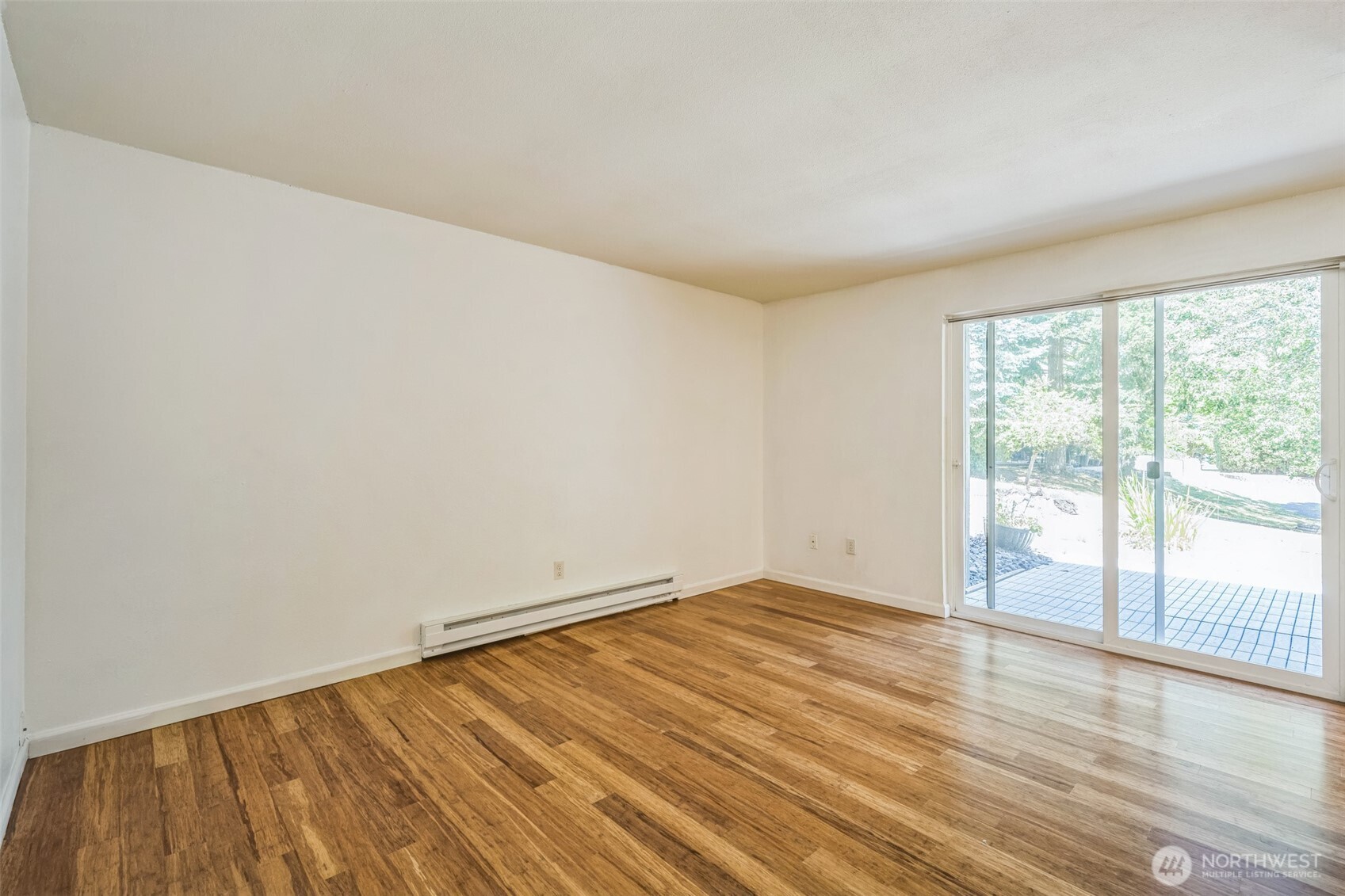 7311 224th Street Southwest, Unit C5 Edmonds, WA 98026 - Photo 17 of 28 a view of an empty room with wooden floor and a window