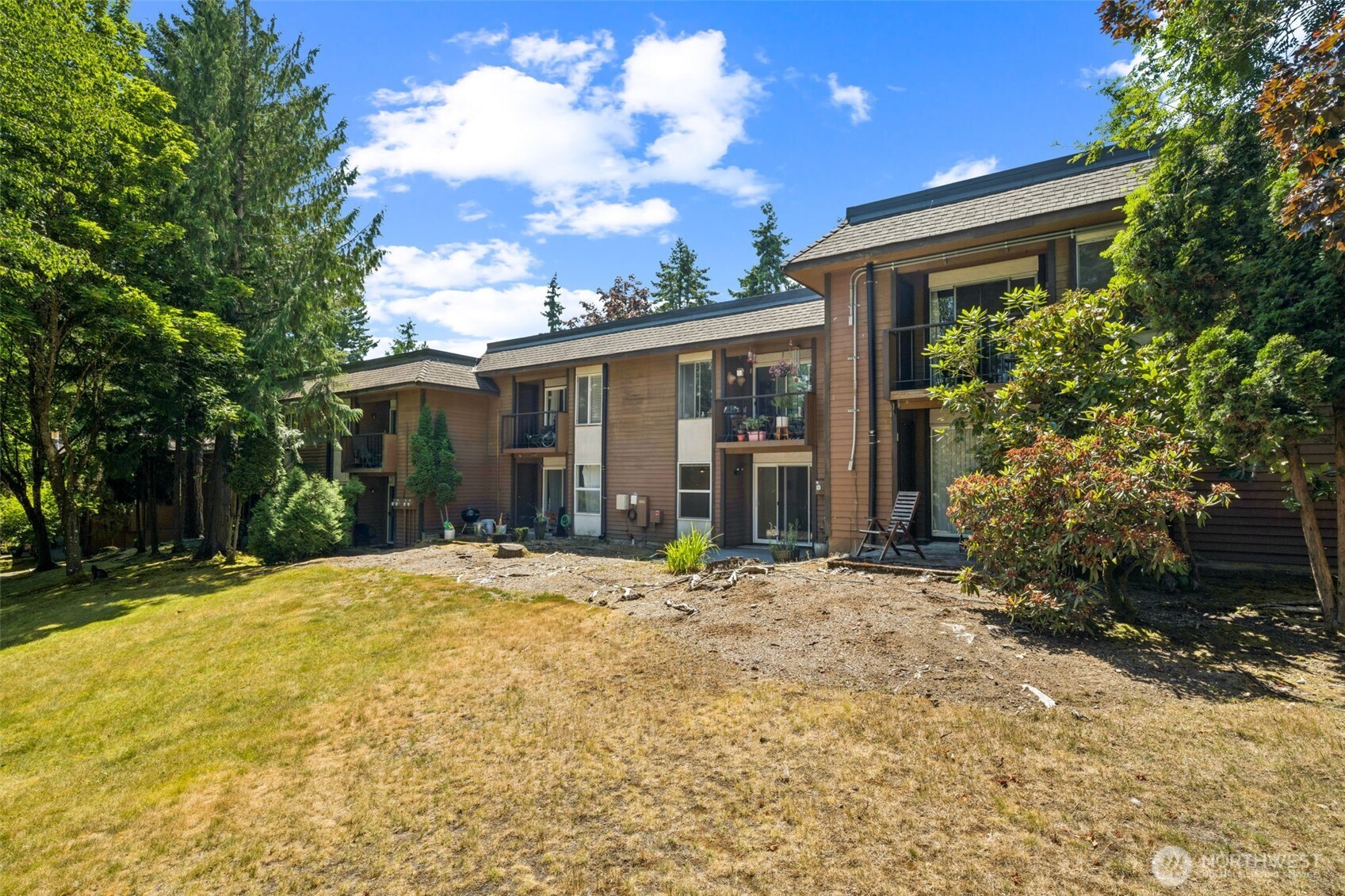 7311 224th Street Southwest, Unit C5 Edmonds, WA 98026 - Photo 2 of 28 a view of a house with a yard and large tree