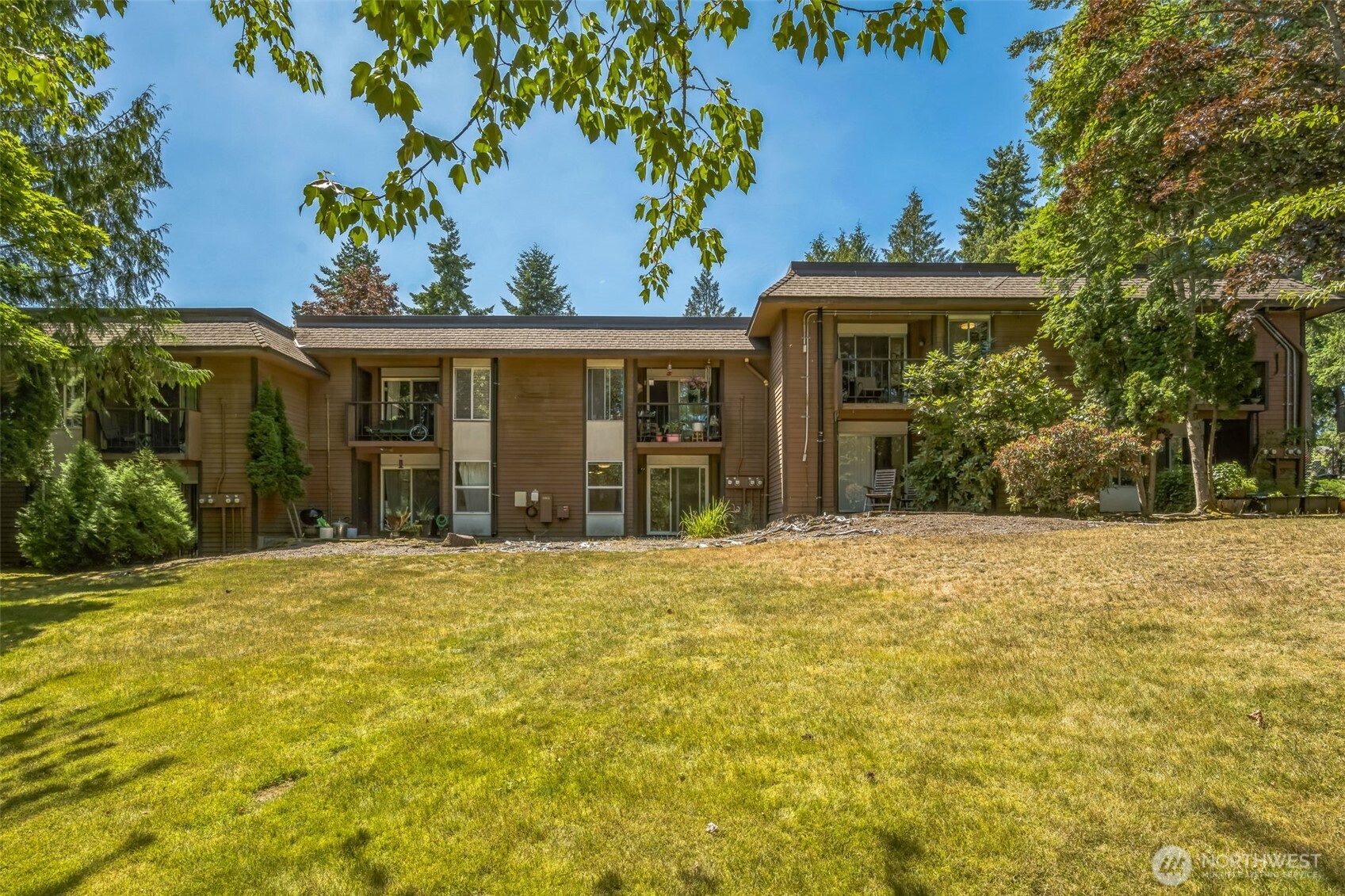 7311 224th Street Southwest, Unit C5 Edmonds, WA 98026 - Photo 29 of 29 a front view of a house with a yard and garage
